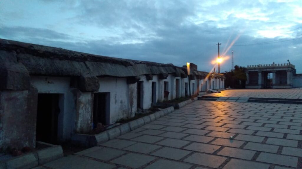 old houses with a street lamp at the end